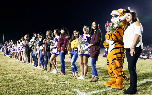Friday night in Tiger Stadium was also Senior Night, a time to honor seniors during their final year. Before the game, the LHS Pep Squad seniors were introduced with their parents.